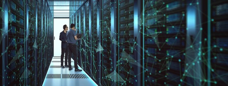 Two people in a server room
